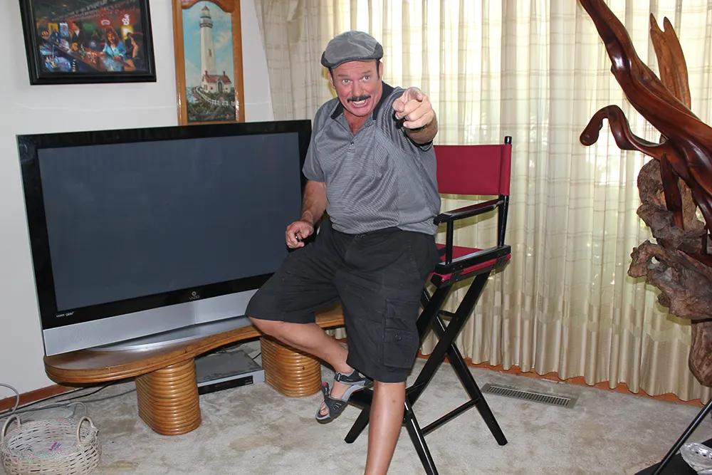 The Producer (2012) Rob Tillitz on a director's chair 1.