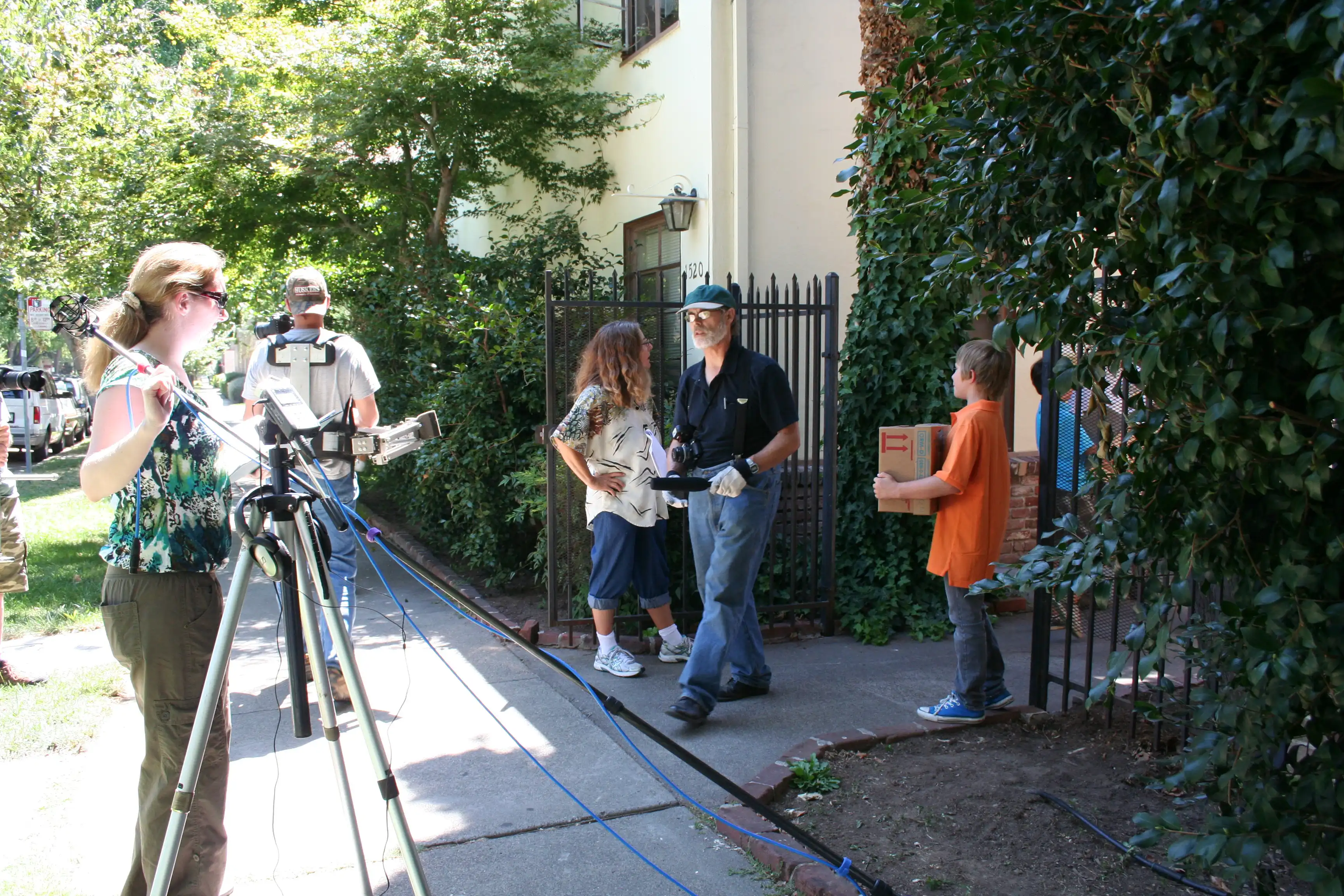 Krystina Mae, Brendan Brooks, Judith Plank, and Scott Slotterbeck in a courtyard for an apartment complex for BUDDIES July 23, 2011.