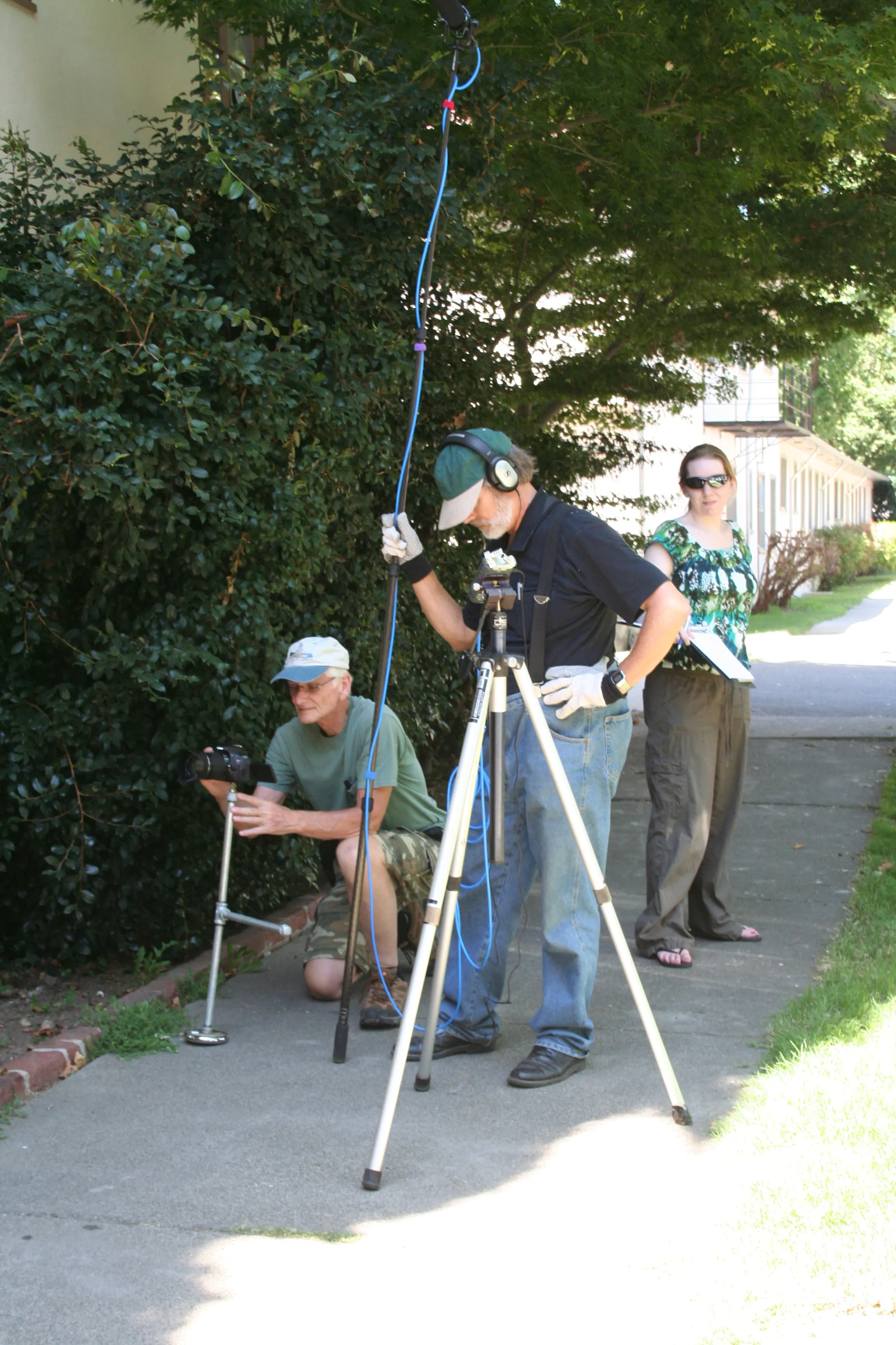 Jim Heck, Scotterbeck, and Krystina Mae in a courtyard for an apartment complex for BUDDIES July 23, 2011.