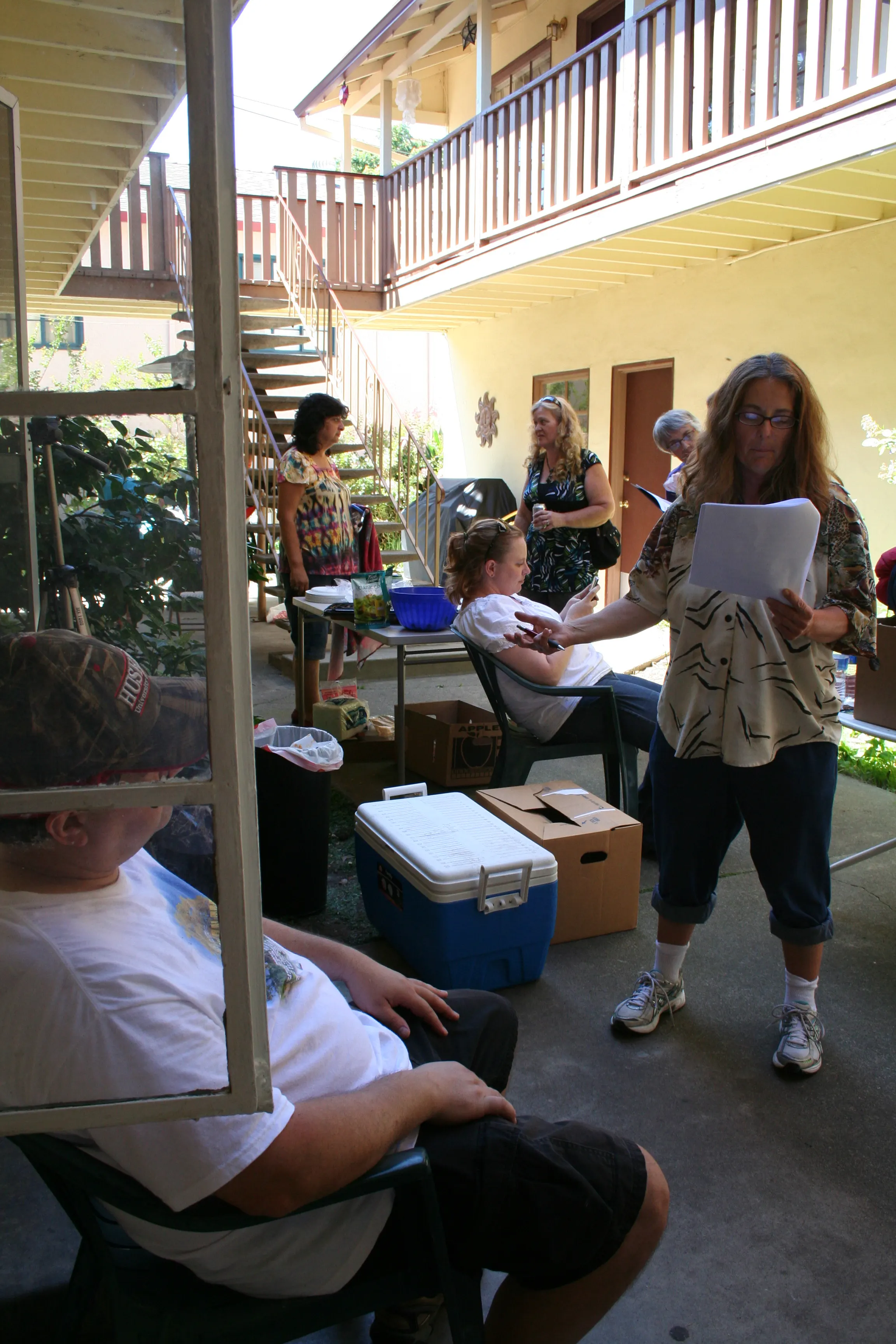 Cast and Crew resting #2 in a courtyard for an apartment complex for BUDDIES July 23, 2011.