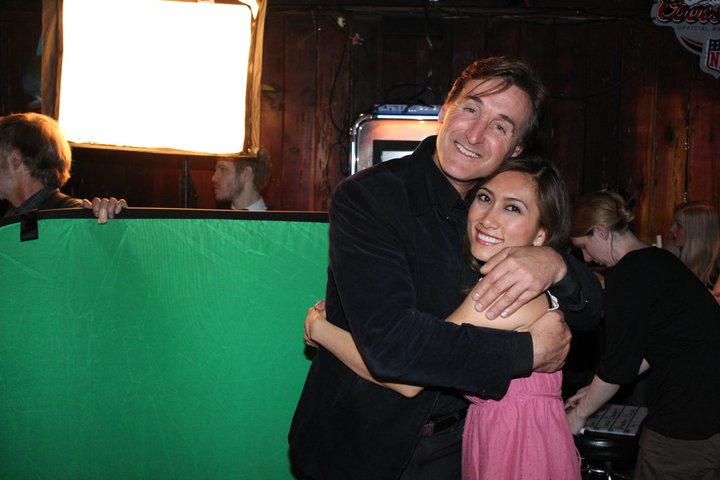 Close friends William Van Noland and Yinique Myo-Flores hug - on the set of the WATERING hole Night 1 at the Cedar Room in Carmichael, California.