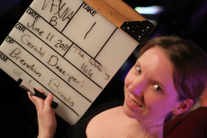 Krystina Mae: second assistant camera smiles for camera - on the set of the WATERING hole Night 1 at the Cedar Room in Carmichael, California.